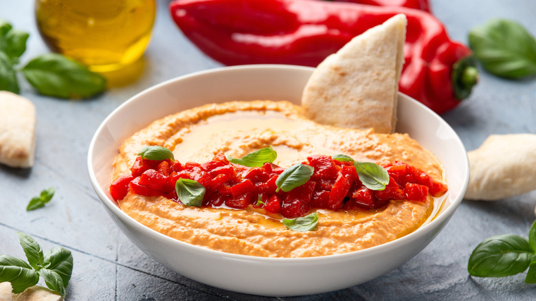 Bowl of roasted red pepper hummus