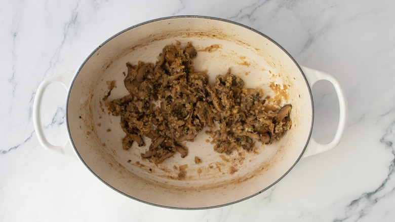 Dutch oven with cooked roux and mushrooms