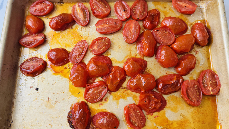 Roasted grape tomatoes on baking sheet