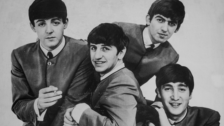 Black and white photos of the Beatles