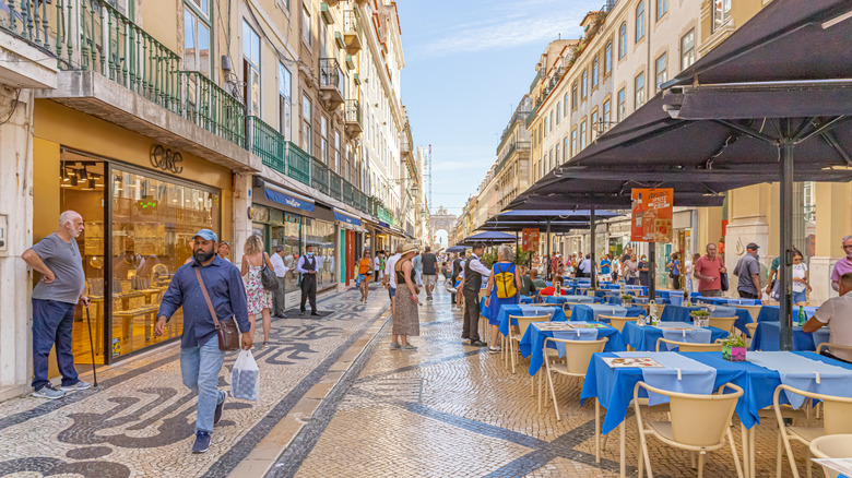 Outdoor dining on Rua Augusta in Lisbon, Portugal.