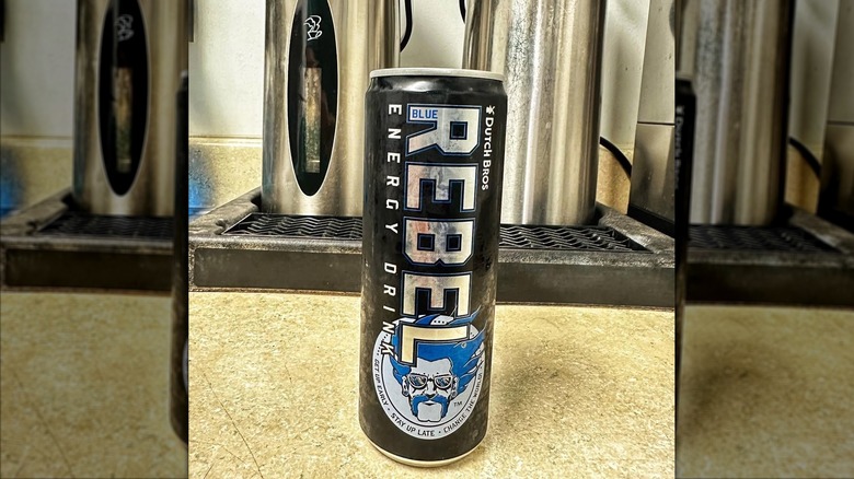 A Blue Rebel energy drink in a black can with its label design displayed.