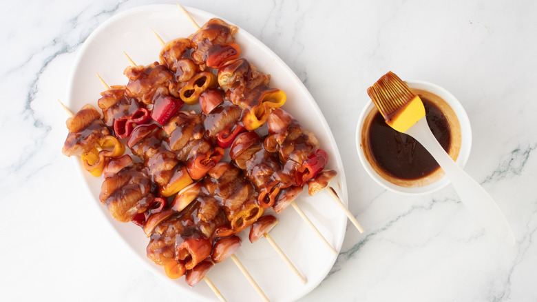 Chicken and vegetable skewers brushed in barbecue sauce