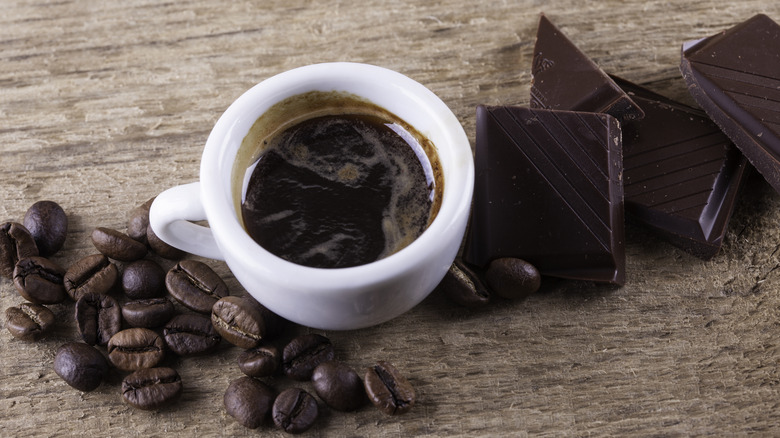 Coffee and chocolate on a wooden table
