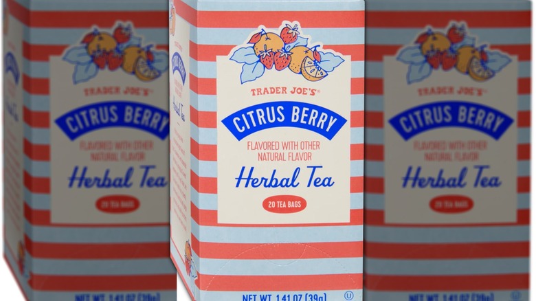 Box of tea bags with red and light blue stripes, a drawing of assorted fruit, and red and blue lettering on a tan background