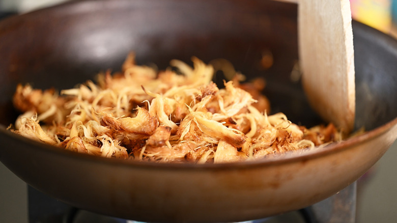 Shredded mushrooms in a pan