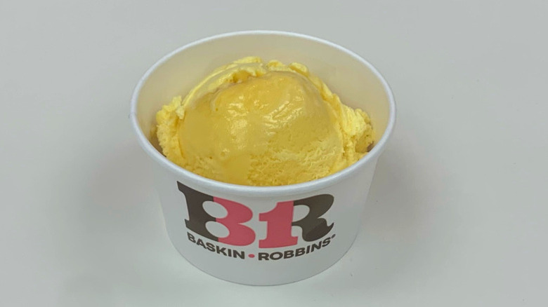 A cup of Baskin-Robbins Triple Mango ice cream