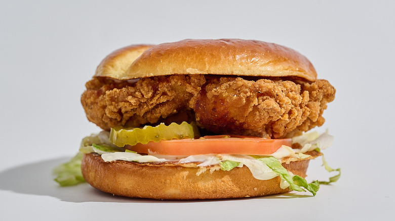Crispy chicken sandwich on a table.