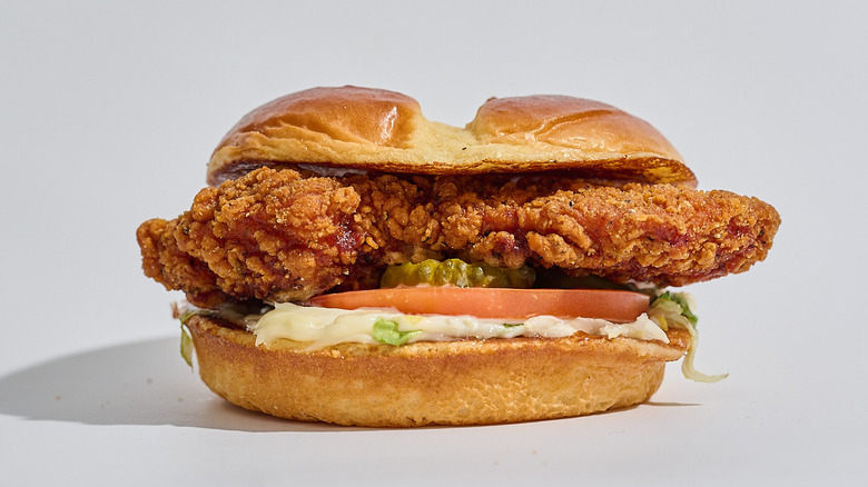 Spicy crispy chicken sandwich on a table.