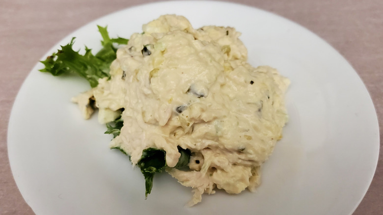 Olivia's Old South chicken salad from Chicken Salad Chick on a lettuce leaf on a small, white plate