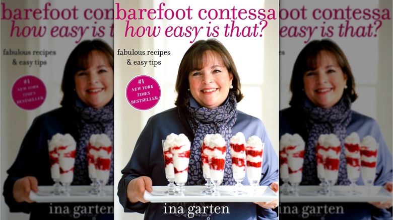 Book cover for Barefoot Contessa How Easy Is That?, showing a smiling Ina Garten holding a tray with five tall parfait glasses filled with whipped cream and a red syrup