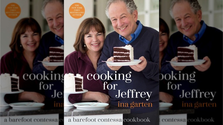 Book cover for Make It Ahead, showing Ina and Jeffrey Garten with Jeffrey holding a white plate with a slice of four-layer chocolate cake with white frosting