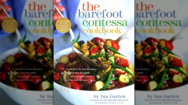 Cover for The Barefoot Contessa Cookbook showing a potato and green bean salad being tossed with serving spoons