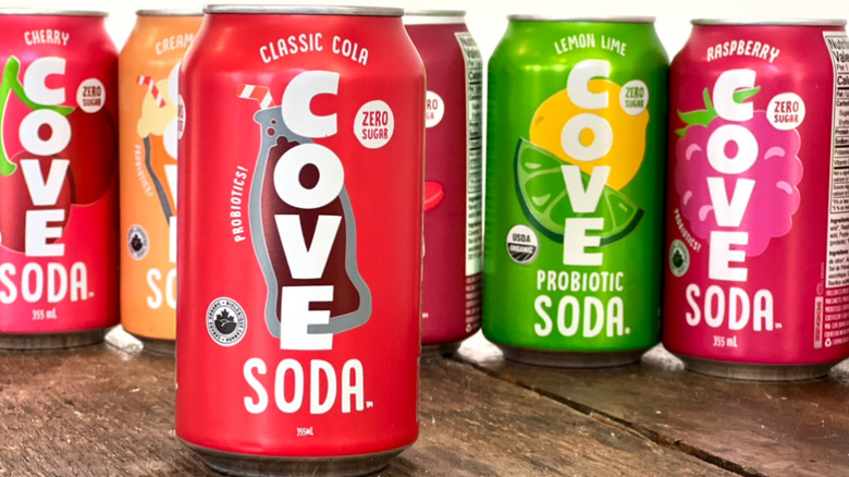 Row of Cove sodas with Cola flavor in the front