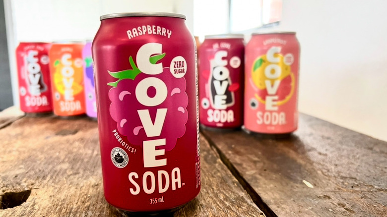 Row of Cove sodas with Raspberry flavor in the front