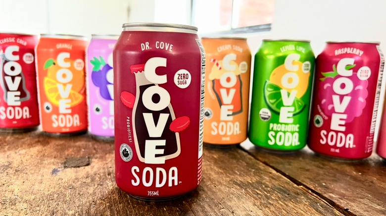 Row of Cove sodas with Dr. Cove in the front