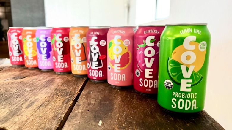 Nine cans of Cove Probiotic Soda in a row