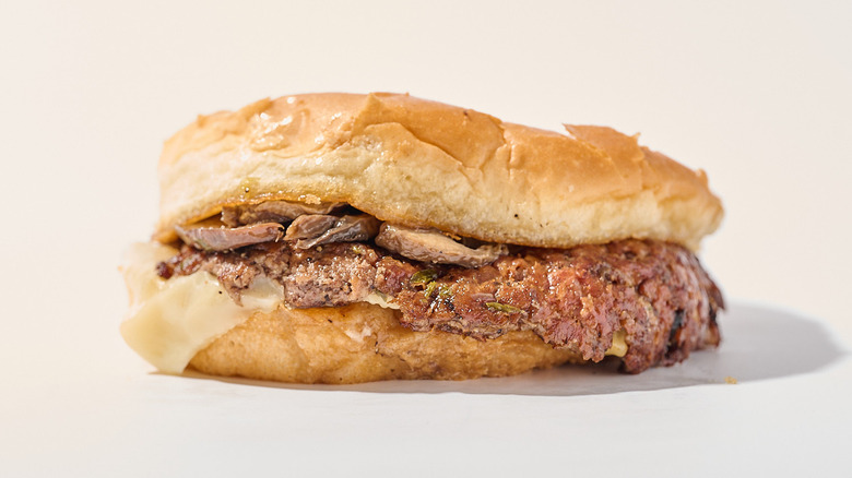 mushroom and swiss hamburger on a table