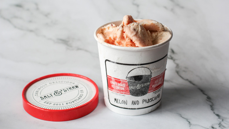 Melon and proscuitto ice cream pint on marble surface
