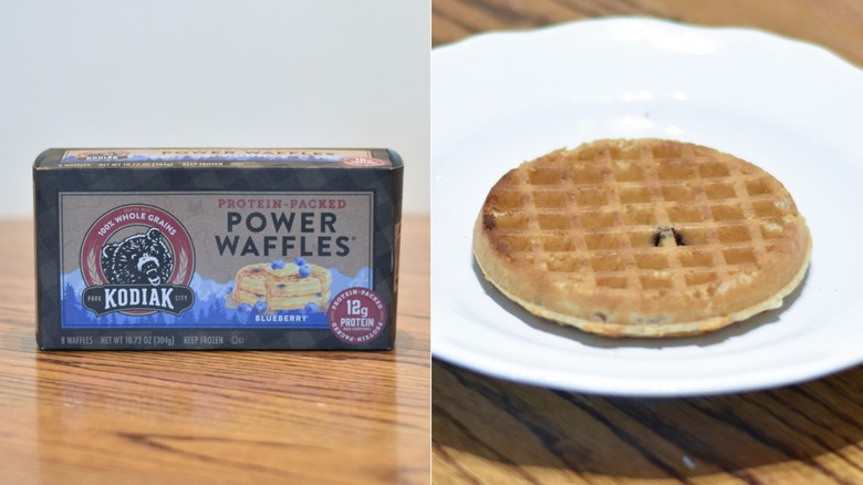 A box of Kodiak blueberry waffles next to a waffle on a white plate