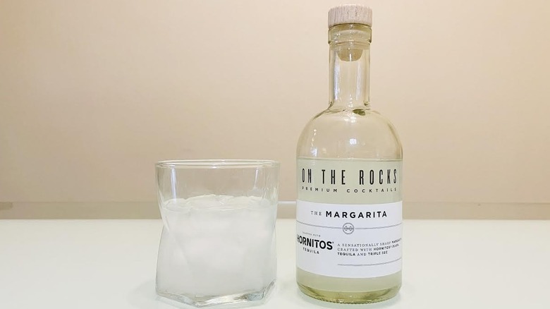 Bottle and glass of On The Rocks Margarita