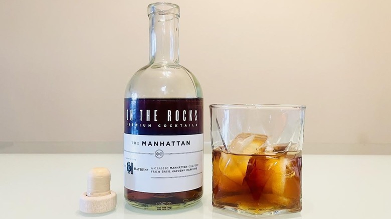Bottle and glass of On The Rocks Manhattan