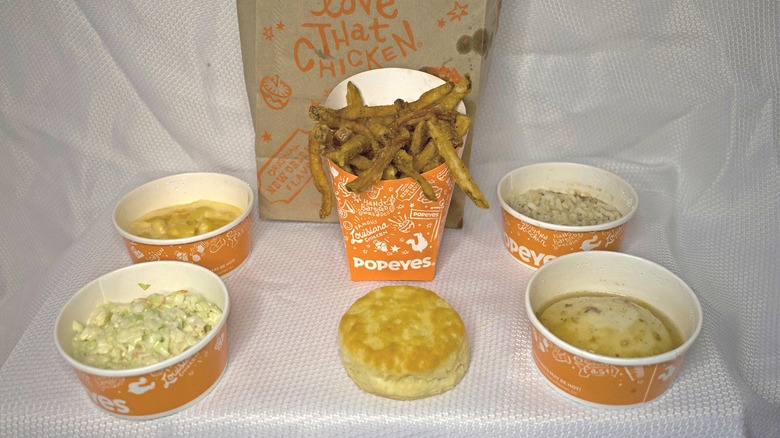 Collection of Popeye's sides with a bag.