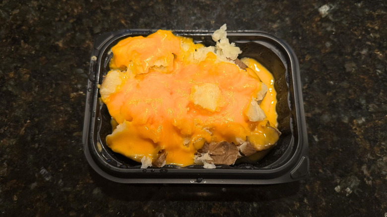 Wendy's Cheese Baked Potato in black to-go container