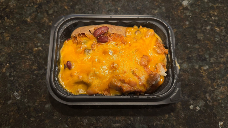 Wendy's Chili & Cheese Baked Potato in black to-go container