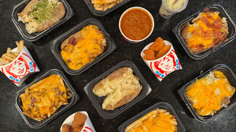 top-down view of various Wendy's side dishes on black counter