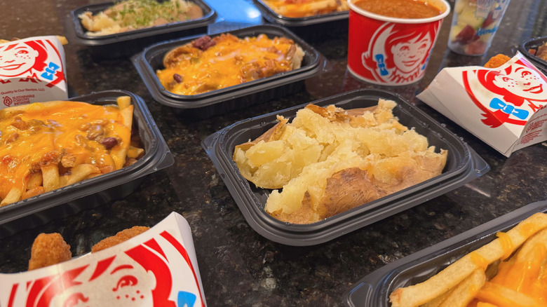 assortment of Wendy's side dishes on black counter