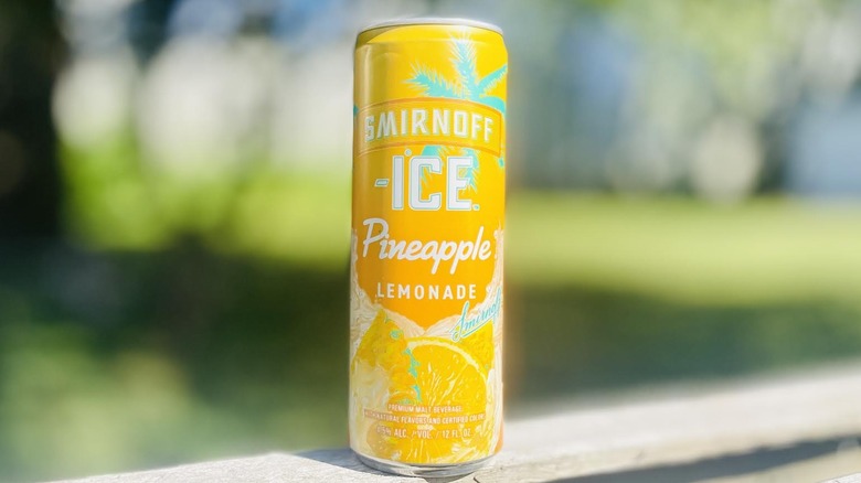 Can of Smirnoff Ice Pineapple Lemonade on outdoor deck