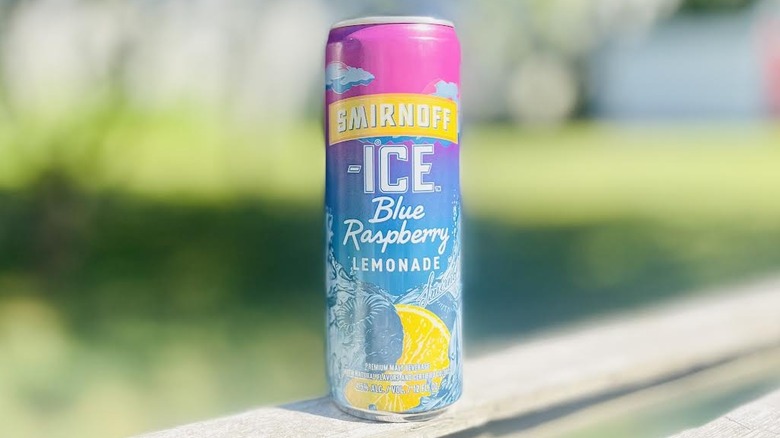 Can of Smirnoff Ice Blue Raspberry Lemonade on outdoor deck