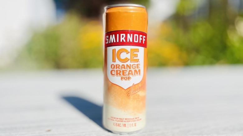 Can of Smirnoff Ice Orange Cream Pop on outdoor deck