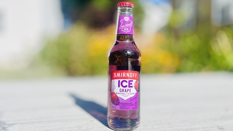 Bottle of Smirnoff Ice Grape on outdoor deck