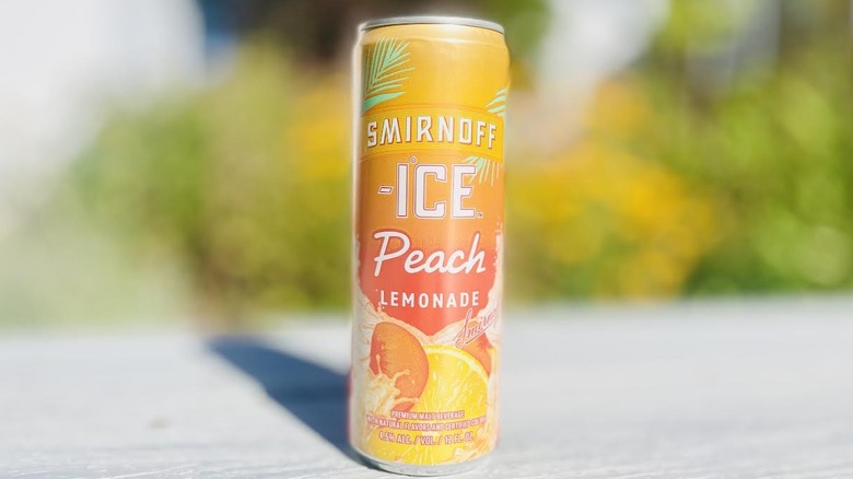 Can of Smirnoff Ice Peach Lemonade on outdoor deck