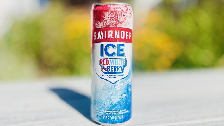 Can of Smirnoff Ice Red, White & Berry on outdoor deck