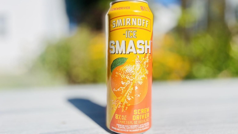 Can of Smirnoff Ice Smash Screwdriver on outdoor deck