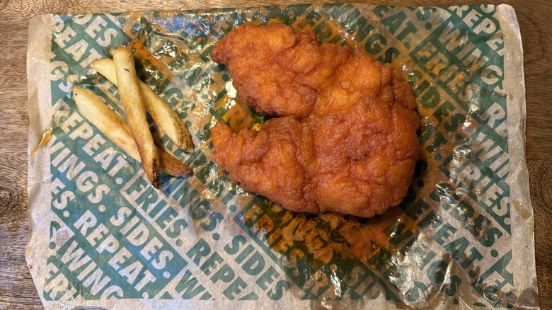 Two Mild tenders and fries on Wingstop food paper