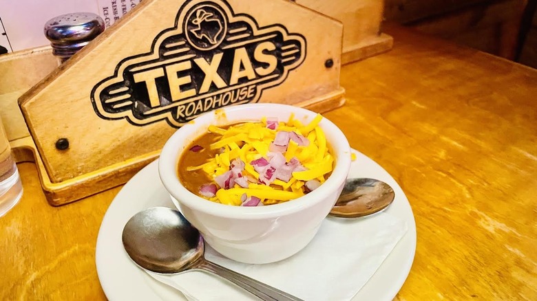 A cup of Texas Roadhouse Texas Red Chili appetizer is shown.