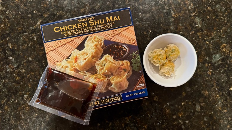 Box and bowl of Trader Joe's Chicken Shu Mai on black counter