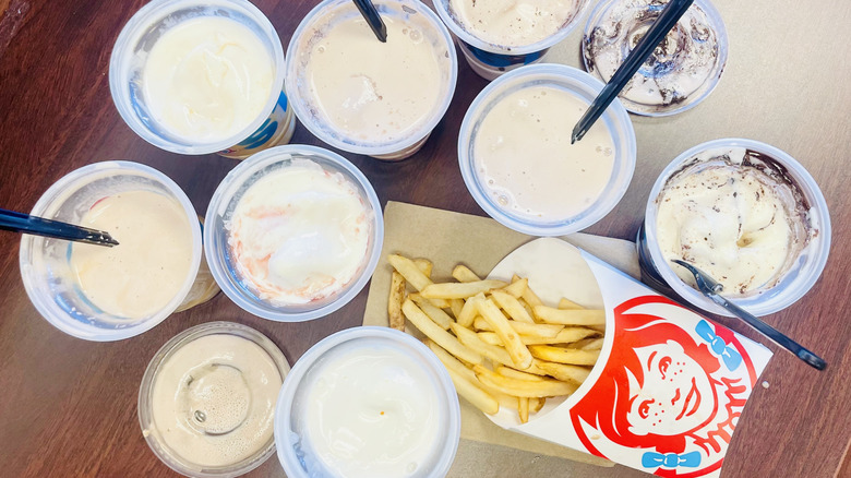 Overhead view of various Wendy's Frostys and french fries