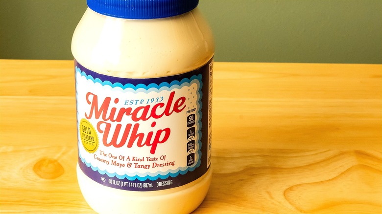 30-ounce container of Miracle Whip on a wooden surface