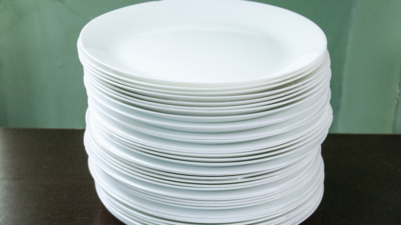 A stack of plain white Corelle plates
