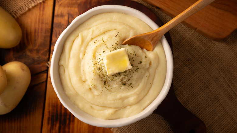A bowl of mashed potatoes photographed from above.