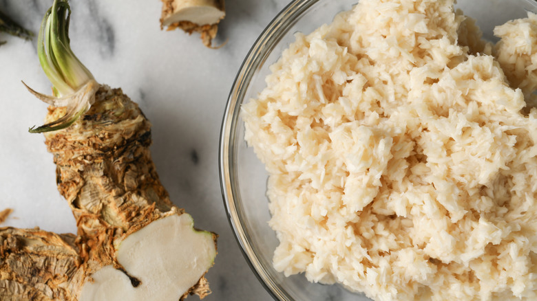 Horseradish roots and prepared horseradish photographed from above.
