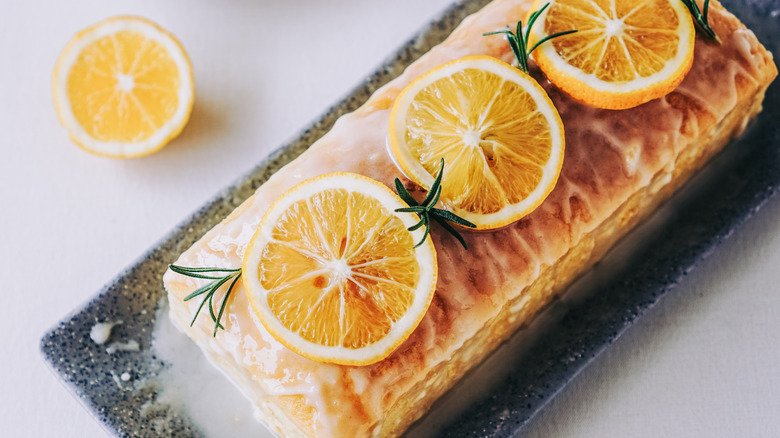 glazed lemon pound cake with sprigs of rosemary