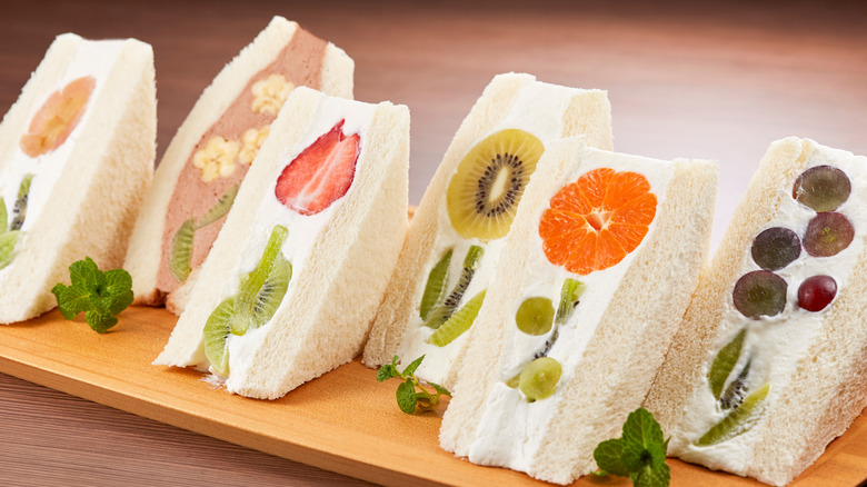 A selection of fruit sando with various flower designs made of fruit