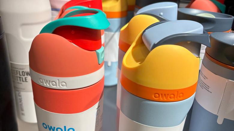 A couple of Owala bottles, most of which showcase a mix of bright colors