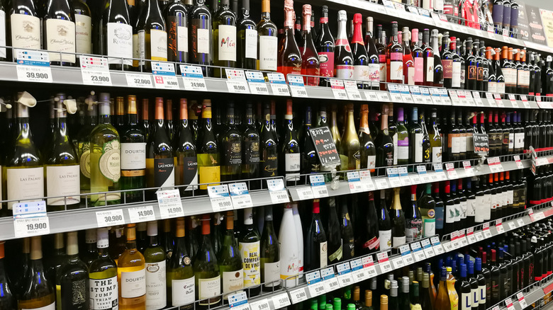 shelves of wine in grocery store